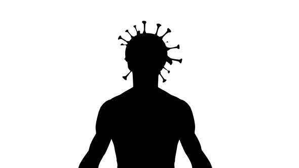 silhouette of a man and covid-19 virus in a human head