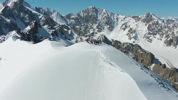 People on Top of Mountain in Sunny Day. Aerial View