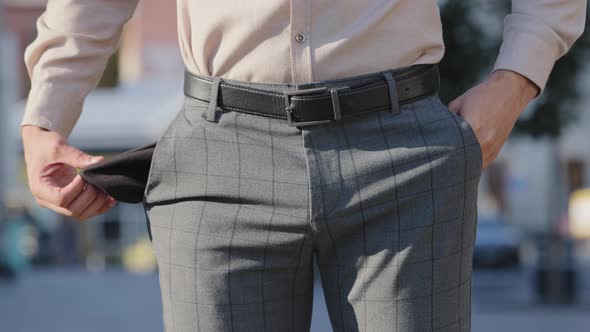 Closeup Unrecognizable Man Turning Empty Pockets in Male Pants