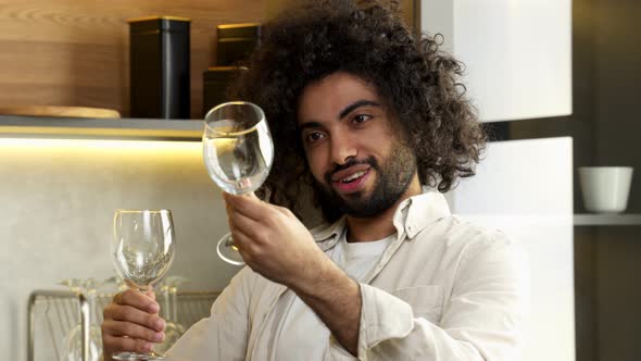 Arabian Man Checks Stains on Wineglasses After Dishwasher