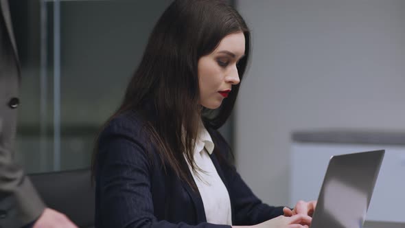 Young Attractive Woman Typing on Laptop Suffering From Boss Harassment Unrecognizable Lustful Man