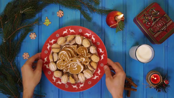 Plate with cookies on a blue table
