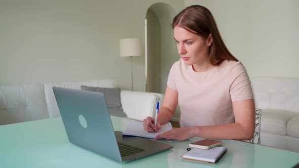 Young Mature Woman Using Laptop for Online Education