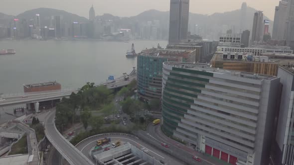 Hong Kong city Aerial view. Victoria bay. Skyscrapers office high glass buildings car traffic sunset