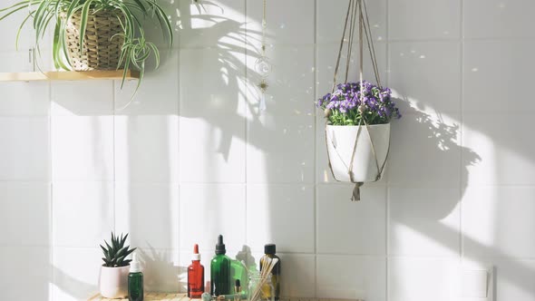 Sun Catcher Crystal Hanging Against White Tile Wall