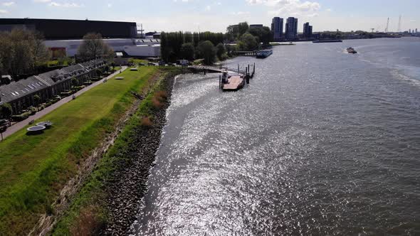 Green Lawn And A Small Port On The River In Kinderdijk Village In Molenlanden, South Holland. aerial