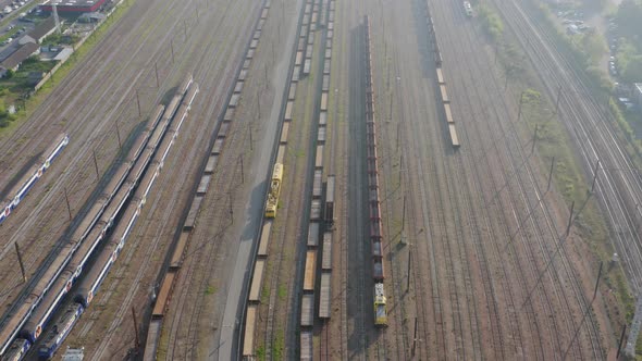 Aerial view of cargo train. Drone Shot of Freight Trains on Station. 