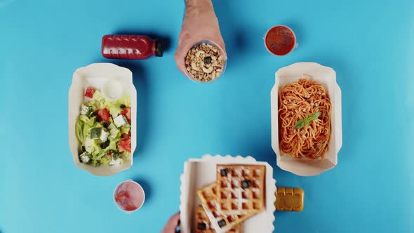 Food Delivery Top View Take Away Meals in Disposable Containers on Blue Background