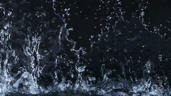 Super Slow Motion Shot of Linear Water Splash at 1000Fps on Black Background