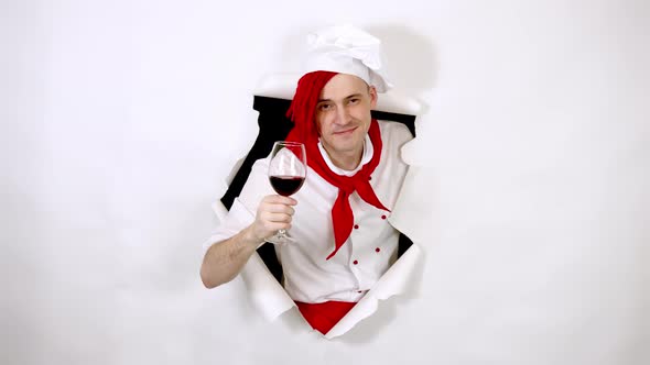 Young Handsome Man Dressed As Chef with Glass of Wine