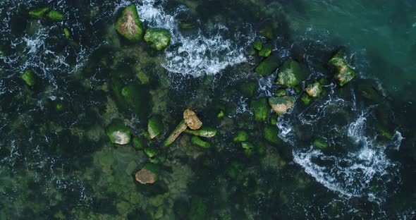 Ocean, sea waves crushing on rocks, overview of crashing waves