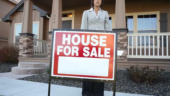 Realtor in front of a house