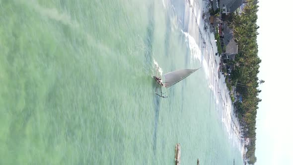 Vertical Video Boats in the Ocean Near the Coast of Zanzibar Tanzania Aerial View