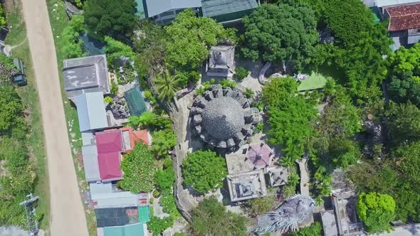 Drone Camera Rotates and Goes Down Above Buddhist Temple