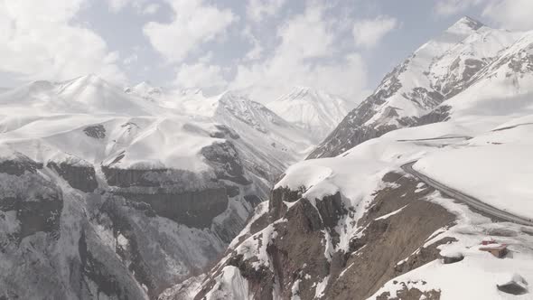 Gudauri, Georgia - April 12, 2021: Aerial view of Russia–Georgia Friendship Monument