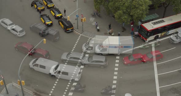 Aerial View. Time Lapse. Crosswalk with Crowds of People Crossing and Traffic. Day in the Big City