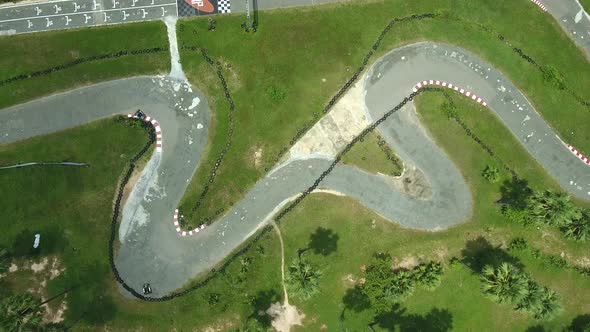 Aerial view above of a group driving kart on a speedway, Cambodia.