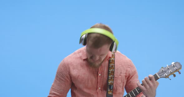 Young Man Rocking Out on Guitar