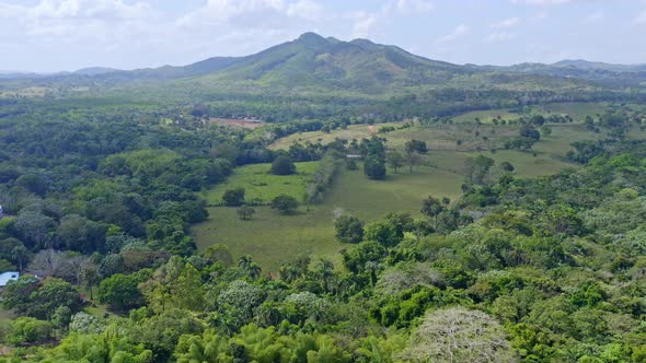 Panoramic View of the Open Fields and Forests with Mountains in the Background in the Bayaguana Domi