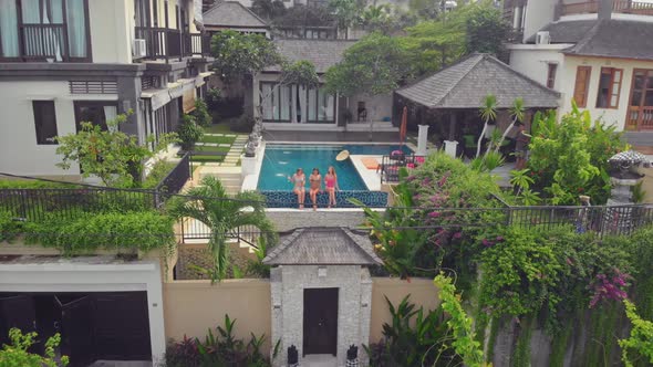 Flight Overlooking the Villa and Girls Near Uluwatu Town on Bali Island Indonesia