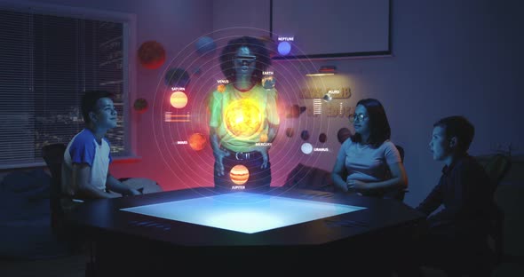 Teacher Using Solar System Hologram in Class