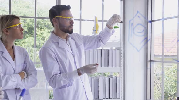 Scientist Work with Science Equipment in Laboratory