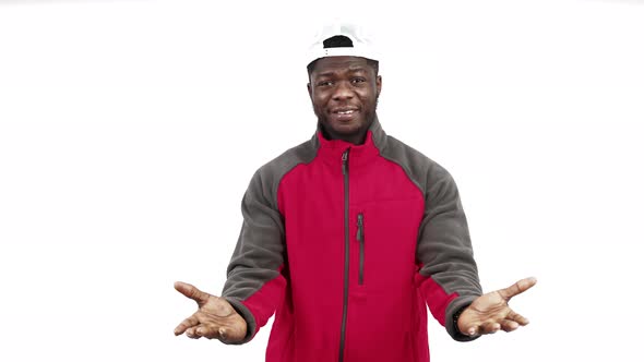 Delivery Man Courier Making an Inviting Gesture Towards you and Smiling Medium Close Up Shot White