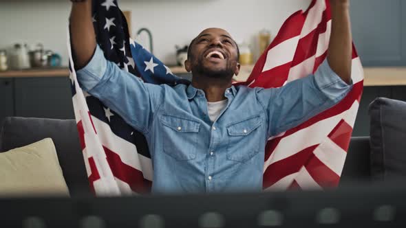 Front view video of extremely happy man with USA flag.  Shot with RED helium camera in 8K