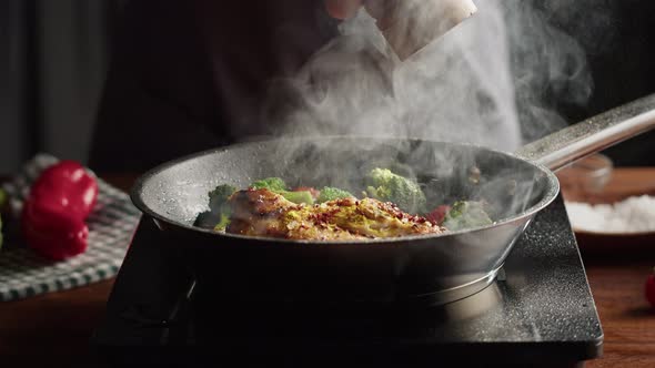 Chef Frying Chicken Breast in Pan Mexican Spicy Cuisine Indian Food Arabian Spices and Hot Pepper