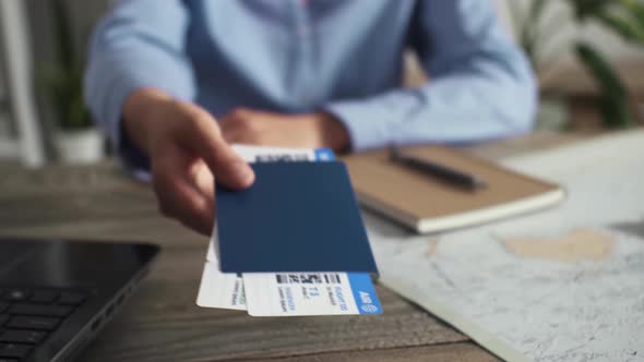 A White Young Woman Travel Agency Worker Issuing Air Tickets For Travel, Issuing Air Tickets