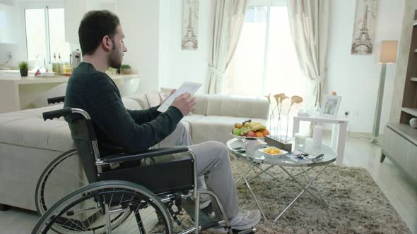 A Young Man In A Wheelchair 