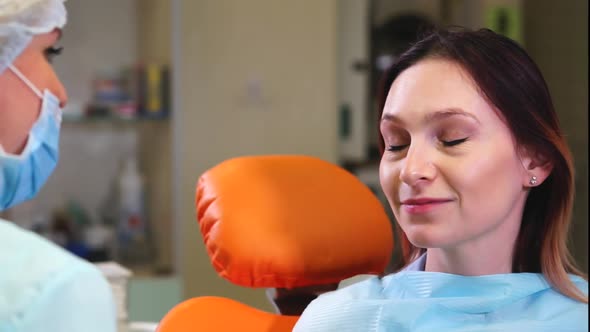 Happy Female Patient in Dental Cabinet