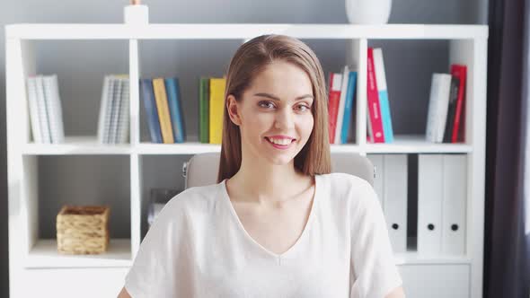 Young Woman Works at Home Office Using Computer.