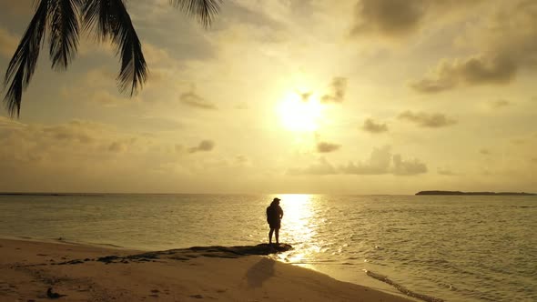 Lady sunbathing on beautiful island beach lifestyle by transparent ocean and white sandy background 