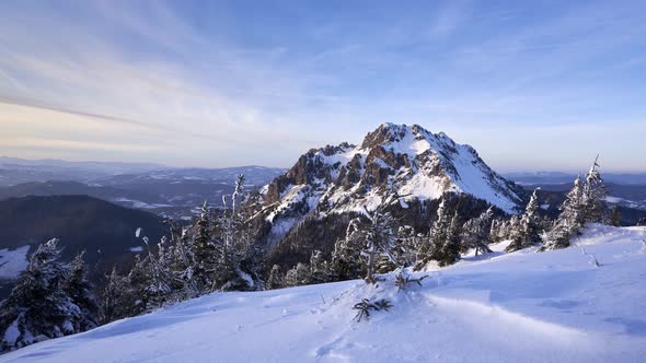 Rocky peak in winter landscape. Snowy mountain nature in the national park,