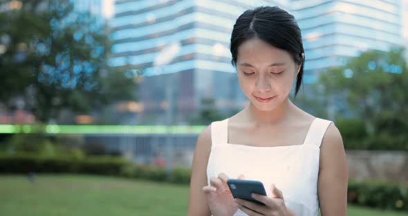 Woman Use of Mobile Phone Inside Shopping Center