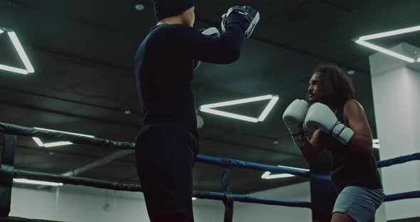 Cuban Darkskinned Pugilist is Training with Coach in Boxing Ring  Prores