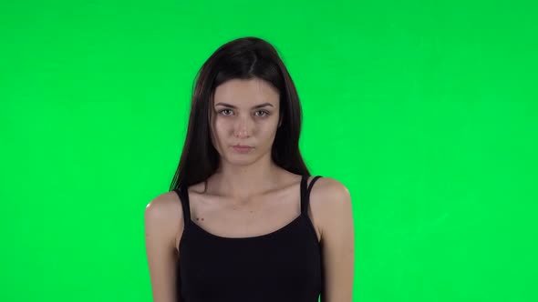 Young Girl Negatively Waving Her Head Expressing She Is Innocent. Green Screen