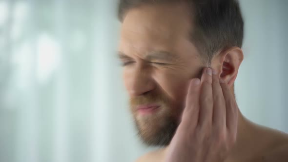 Man Feels Pain in Middle Ear, Meningitis and Hearing Loss, Inflammation, Closeup