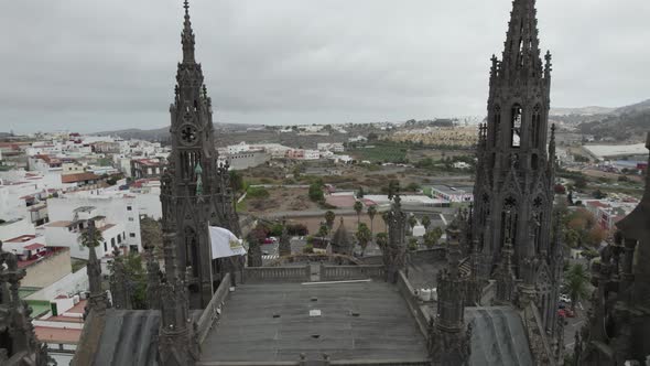 Fly over The Church of San Juan Bautista or Arucas Church, beautiful Neo-Gothic style towers, Canary
