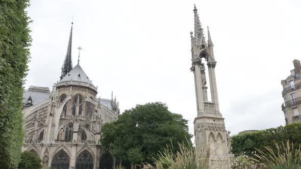 Art of Notre-Dame Cathedral located in French capital Paris slow tilt 4K 2160p 30fps UltraHD footage