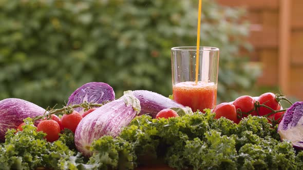 Tomato juice pouring into a glass