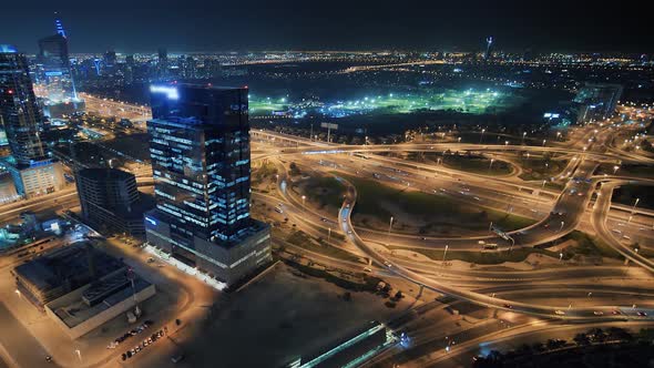 Panorama of the Dubai Area with a Road Junction and Traffic at Night