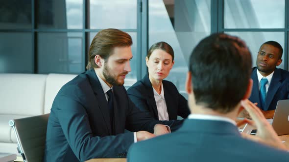 Meeting of diverse businessmen in the office