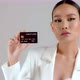 Beautiful Asian businesswoman showing credit card and looking at camera - VideoHive Item for Sale