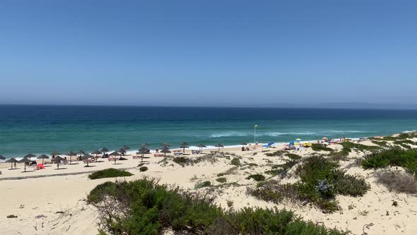 The best beach with yellow sand and blue ocean at Pego (nearby Carvalhal) in Alentejo, Portugal