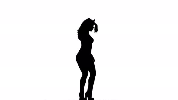 A Silhouette Woman Is Casually Dancing Against A White Background