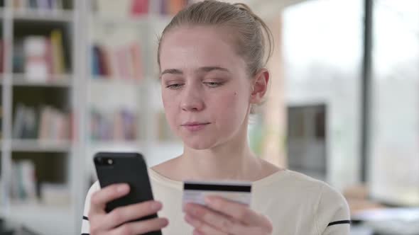 Portrait of Online Payment on Smartphone By Young Woman