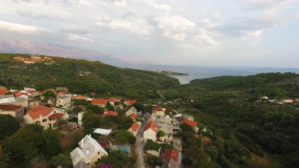 Moving aerial point of view from the town going to the sea in Sumartin Brac Island Croatia