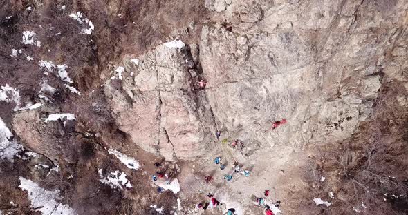 A Group of People are Engaged in Rock Climbing